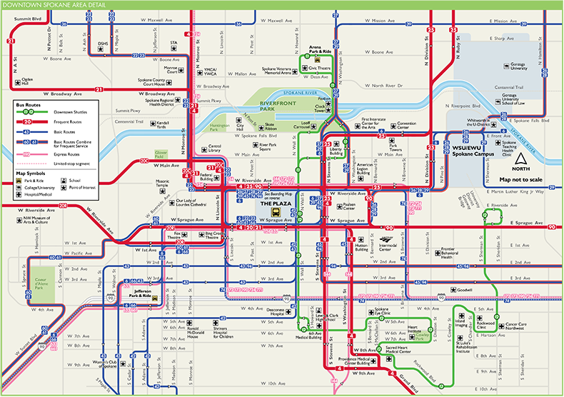 A detailed map of downtown Spokane showing bus routes with various colored lines and STA Plaza boarding zones. Several points of interest, transit stations, parks, and the Spokane River are marked. Major streets and intersections are labeled, with The Plaza central to the map.