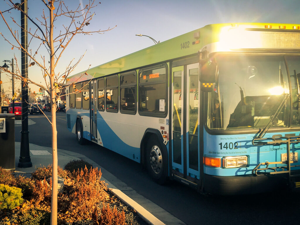 Bus driving down road.