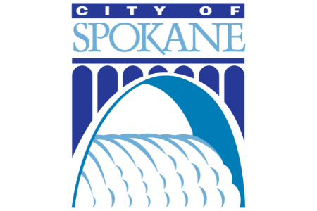 A logo featuring the City of Spokane. The design includes an arch bridge above the words "City of Spokane" in blue and white, with cascading water depicted below the bridge.