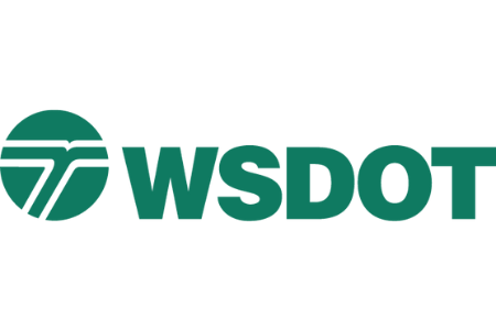 The image displays the logo of the Washington State Department of Transportation (WSDOT), featuring a green circular emblem on the left with lines resembling a road or path, and the letters "WSDOT" to the right in green text.