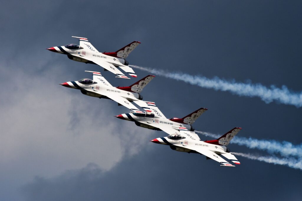 Image of the United States Air Force (USAF) Thunderbirds aerobatics team flying in the sky.