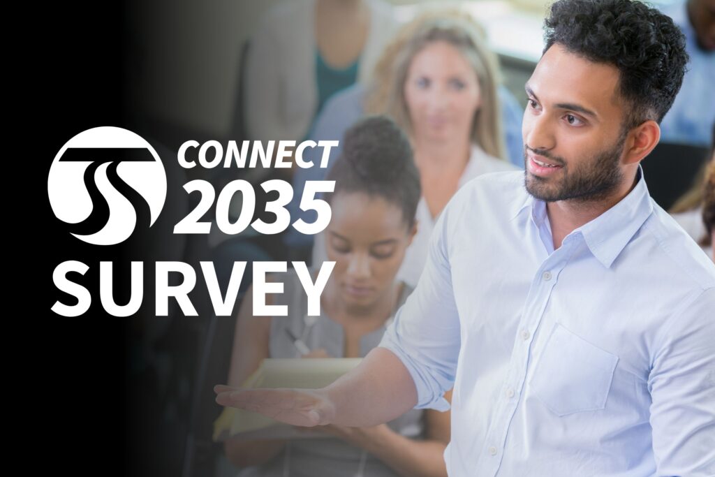 A man speaks at a survey event with "Connect 2035 Survey" written on the left side.