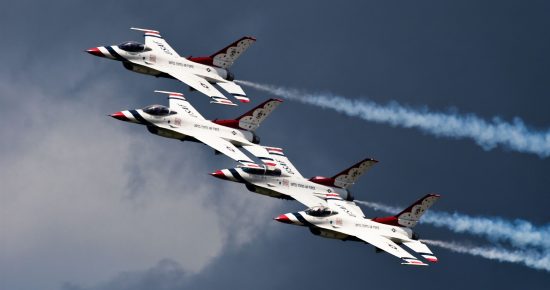 Image of the United States Air Force (USAF) Thunderbirds aerobatics team flying in the sky.